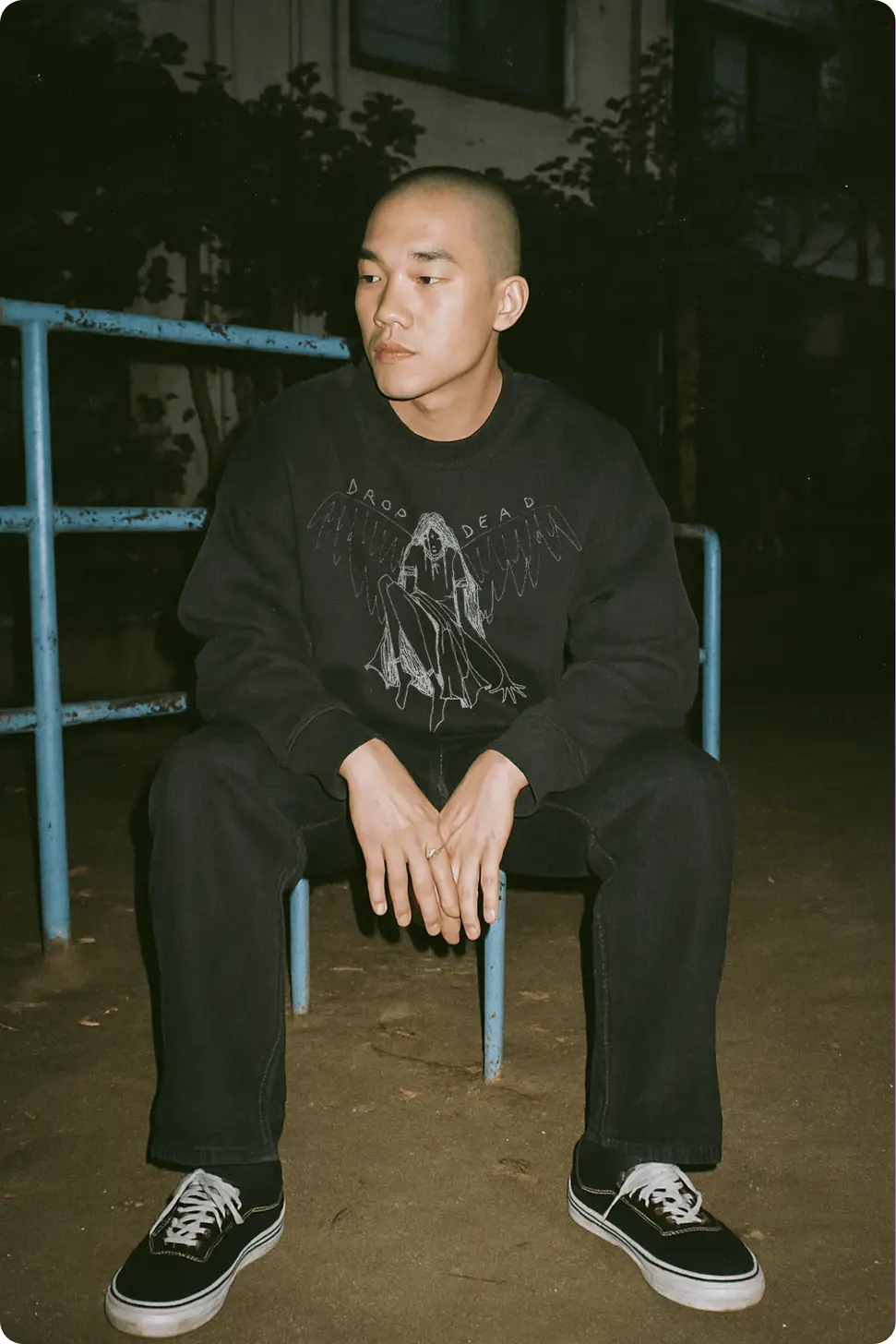 Mockup87 - Mock It AI ai asian male model sitting down wearing a sweatshirt mockup