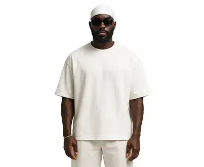 Split photo: YSL t-shirt vs Just Do It hoodie on caped model.